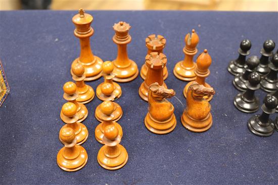 A Jaques Staunton boxwood and ebony chess set, knights and rooks stamped with a crown and the white king kings 8.5cm